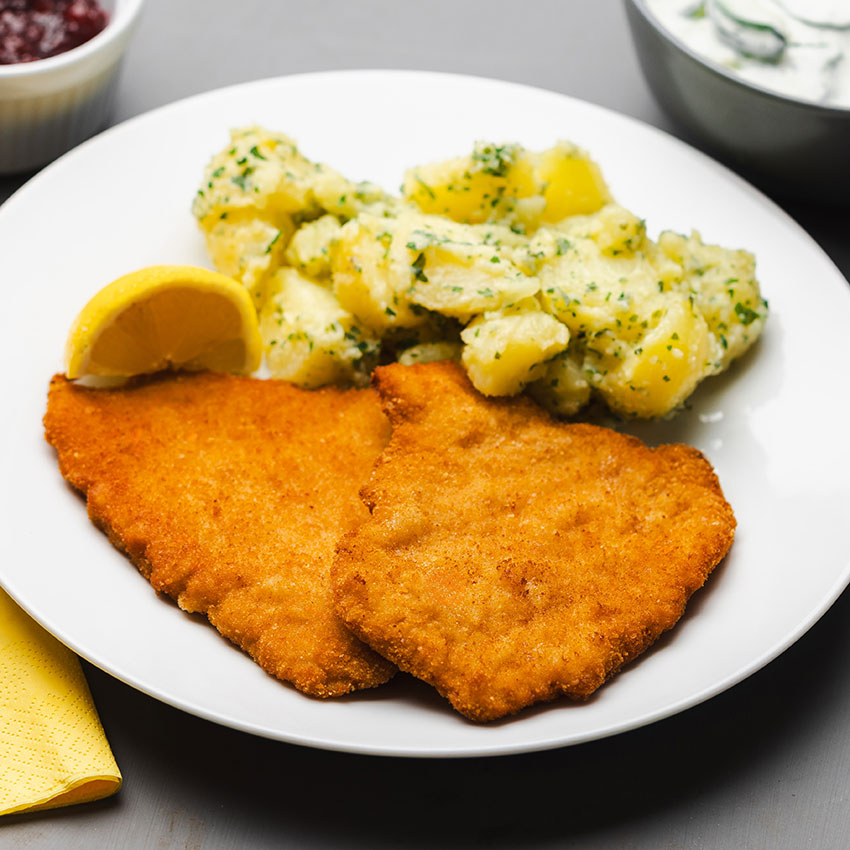Schweinsschnitzel paniert 10 Stk = 1000 g tiefgefroren, Schweinsschnitzel paniert kaufen. Schweinsschnitzel online bestellen, Schweinsschnitzel paniert von Wiesbauer Gourmet